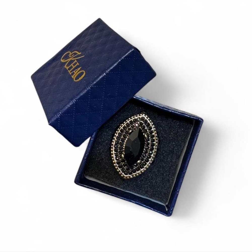 Elegant Black and Gold Ring